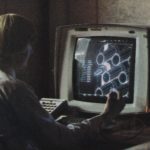 engineer using generative design software at workstation