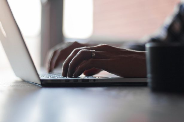 A blogger working on a laptop in a home office